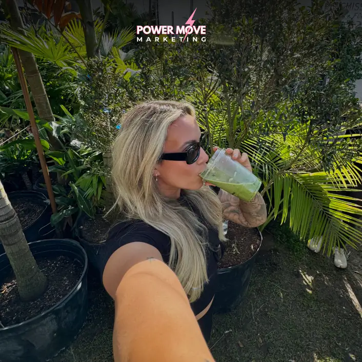 girl taking selfie while drinking matcha